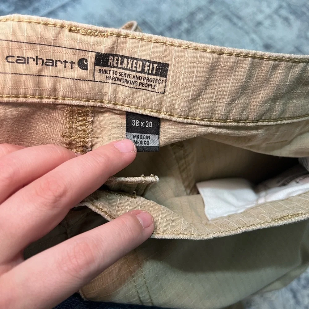 TWO pair of carhartt relaxed fit khakis - 38X30